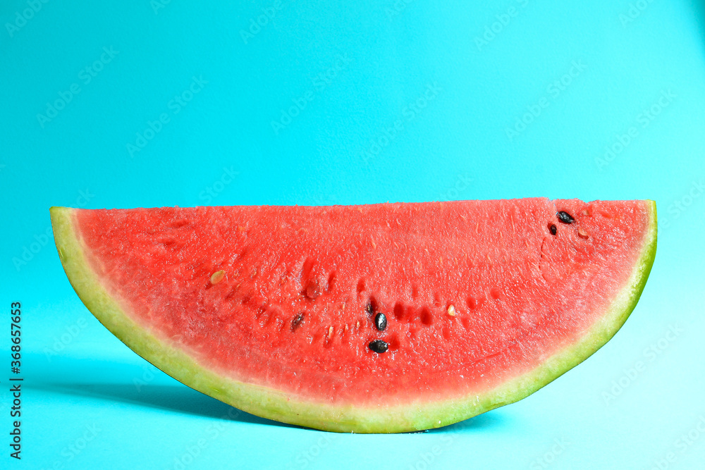 Fresh sliced watermelon isolated on blue background. Ripe red watermelon. Minimal creative concept. Place for text. Bright healthy summer food. Fresh sliced watermelon isolated on blue background. Ripe red watermelon. Minimal creative concept. Place for text. Bright healthy summer food.