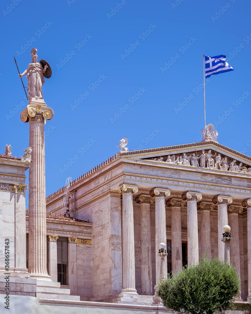 Athens Greece, the national academy lassical building white marble facadewith Athena statue
