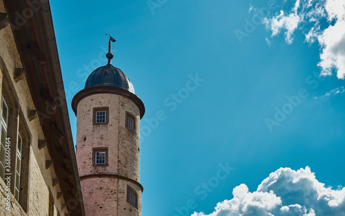 an old beautiful tower standing alone with blue sky in the background photo