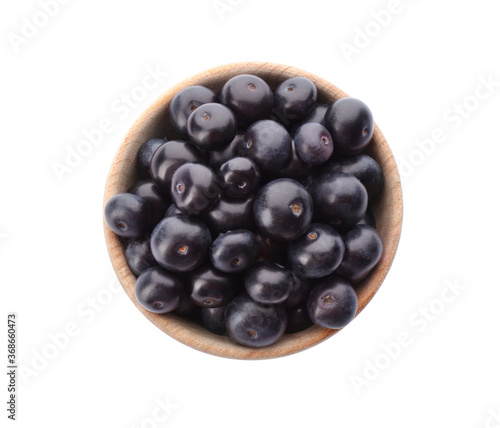 Fresh acai berries in bowl isolated on white, top view