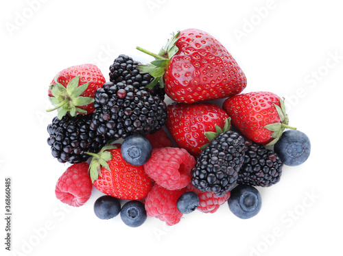 Pile of different ripe tasty berries isolated on white  top view