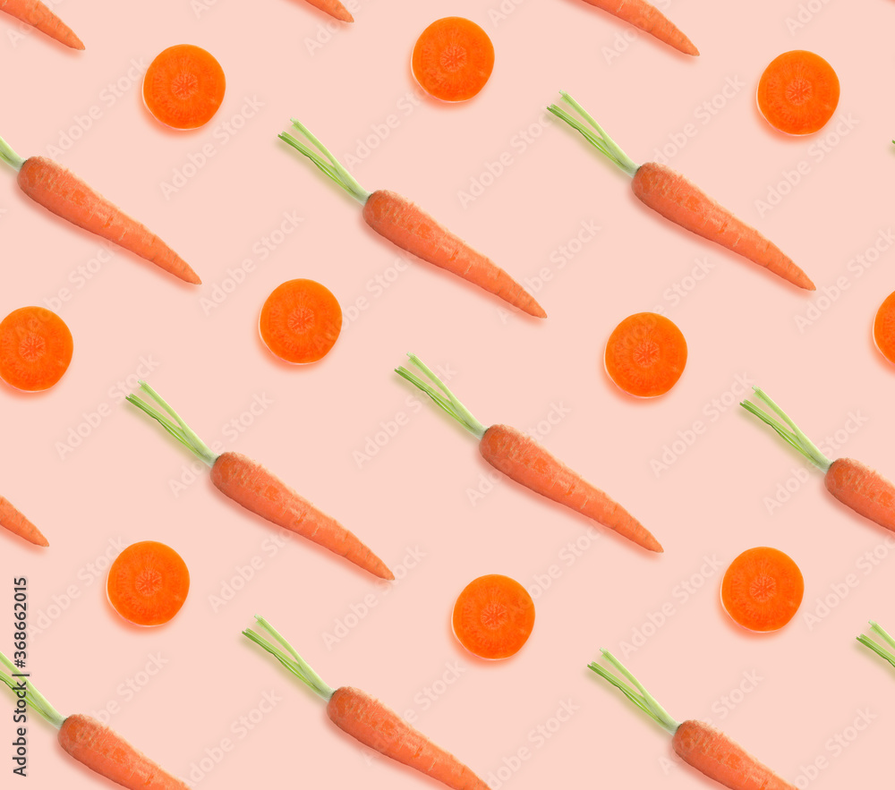 Carrots on pale pink background. Pattern design Carrots on pale pink background. Pattern design