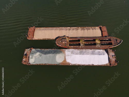 Barge with sand on the river