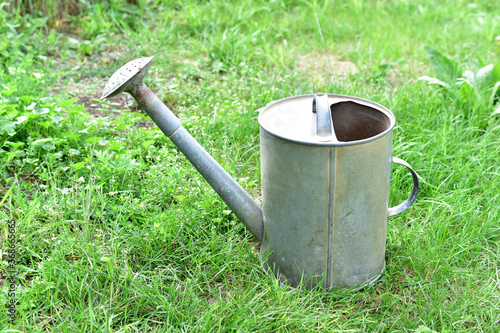 Common iron garden watering can for watering plants