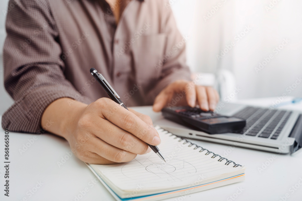 businesswoman hand using smart phone,mobile p payments online shopping,omni channel,digital tablet docking keyboard computer at office in sun light businesswoman hand using smart phone,mobile p payments online shopping,omni channel,digital tablet docking keyboard computer at office in sun light