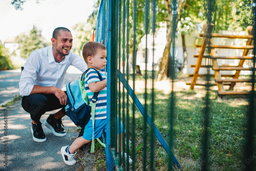 Fototapeta premium Father and son going to kindergarten