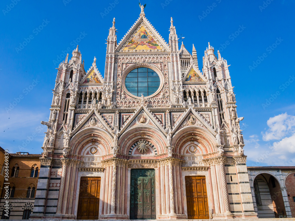 Stunning view of Siena Cathedral main facade, a medieval church now dedicated to catholic Assumption of Mary, Tuscany, Italy
