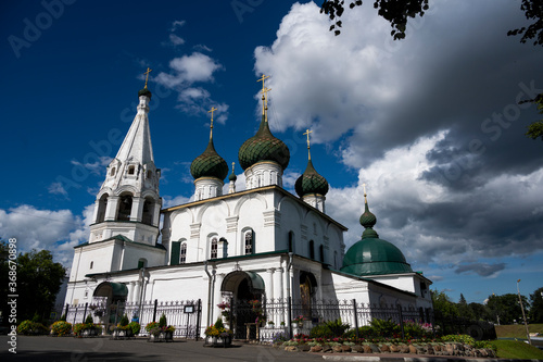 white stone old buildings with golden domes against the blue sky