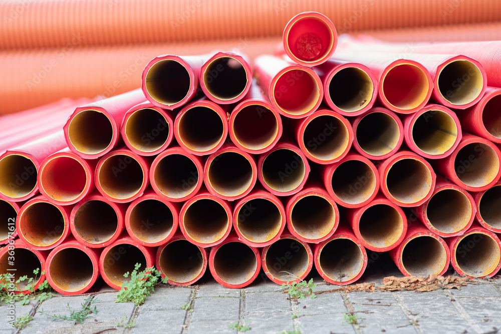 Red plastic pipes at a construction area Red plastic pipes at a construction area