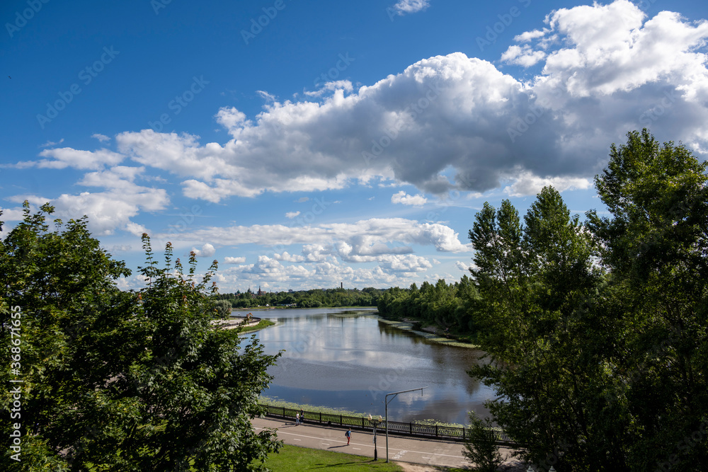 Fototapeta premium river embankment with buildings and a park