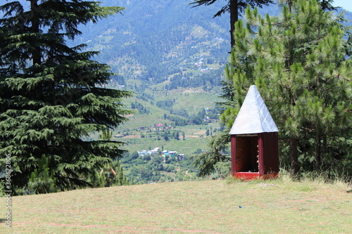 scenic view of the small temple situated in the hills photo