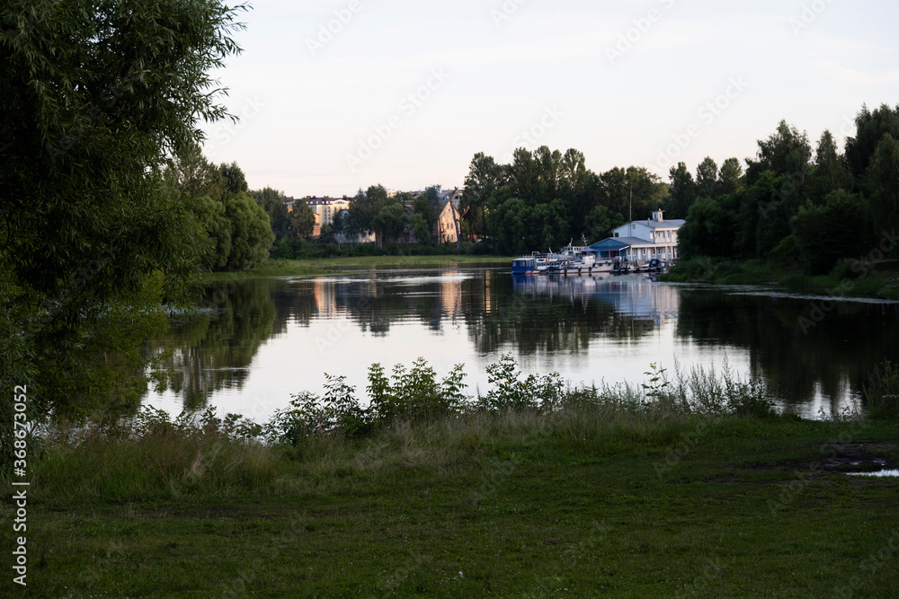 Fototapeta premium views with country buildings in summer in a green city