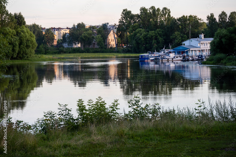 Obraz premium city forest and river at sunset