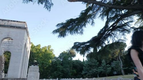 Wallpaper Mural elegant woman sitting on a marble balustrade in the city looking at panorama Torontodigital.ca