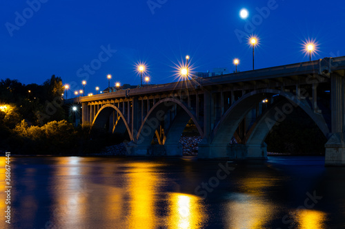 A picturesque view of the Broadway Bridge and South Saskatchewan River in the City of Saskatoon late at night 
