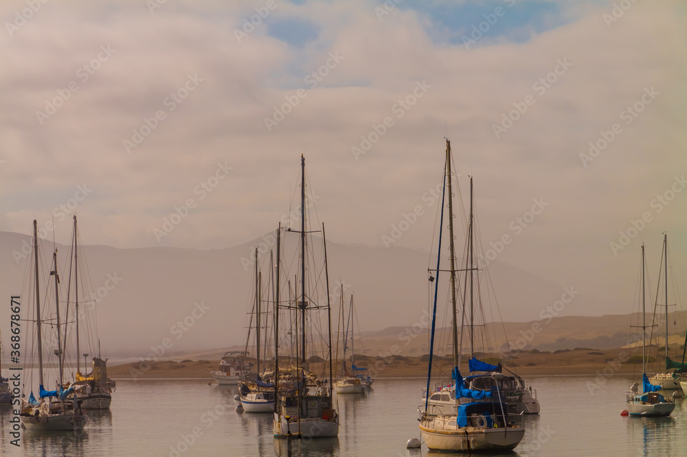 Sailboats Moored in Morro Bay With Fog Shrouded Valencia Peak in The Distance, Morro Bay, California, USA