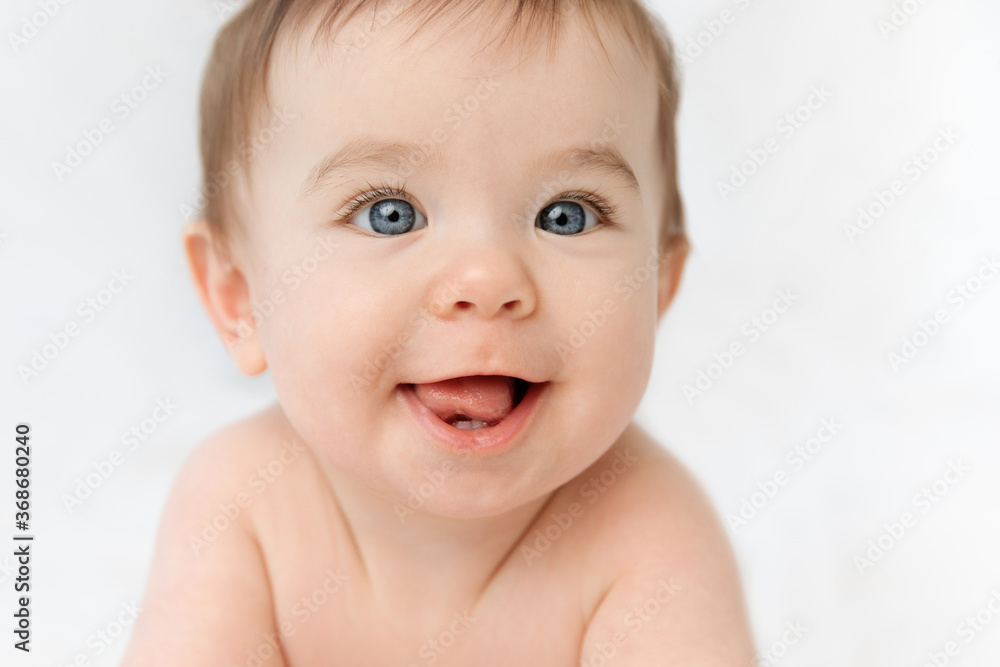 Close up of smiling baby face looking at camera Close up of smiling baby face looking at camera