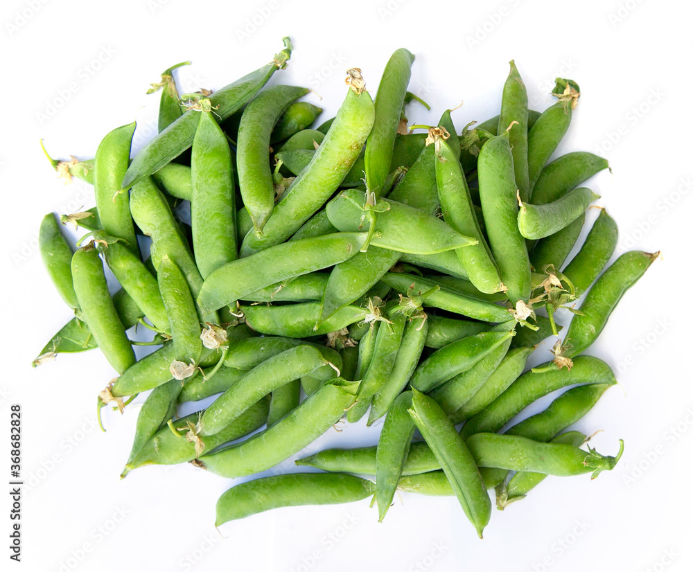 slide of green unpeeled peas on white background for your design or menu design slide of green unpeeled peas on white background for your design or menu design