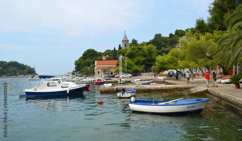 Cavtat harbor with small boats and church.