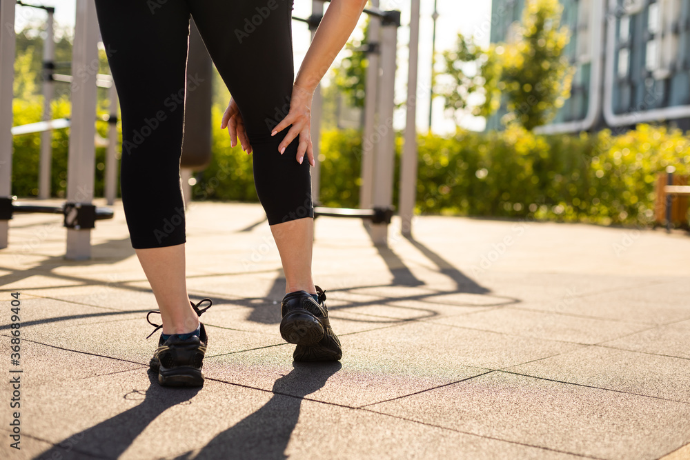 woman working out in gym on equipment outdoors having fun woman working out in gym on equipment outdoors having fun