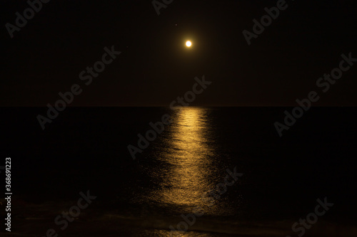 Full Moon over the sea in Bussana, Italy