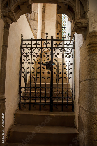 Chesky Krumlof church staircase with ornamental flower gate photo