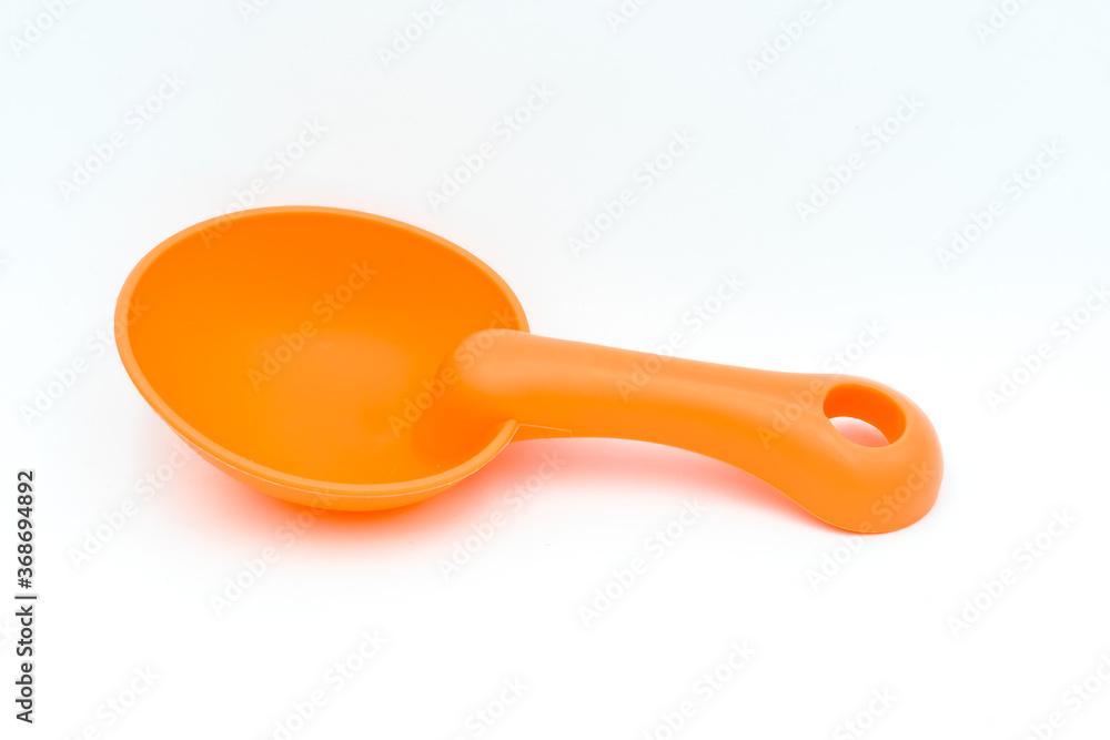 Beach toys: a sand scoop on a white background Beach toys: a sand scoop on a white background