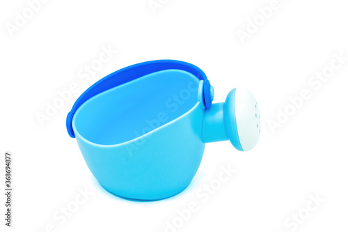 Beach toys: mini watering can on a white background