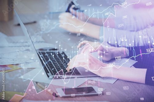 Multi exposure of woman hands typing on computer and financial chart hologram drawing. Stock market analysis concept.