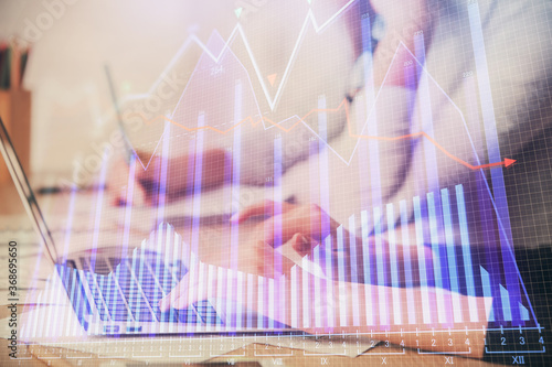 Multi exposure of woman hands typing on computer and financial chart hologram drawing. Stock market analysis concept.