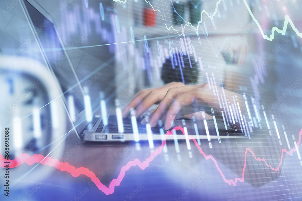 Double exposure of woman hands typing on computer and forex chart hologram drawing. Stock market invest concept.