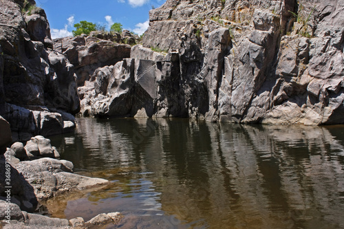 Geology. Nature texture. View of the river, rocks, popular cliffs Los Elefantes and the reflection in water. © Gonzalo