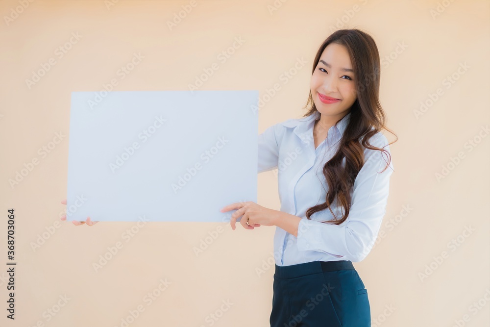 Portrait beautiful young asian business woman show white empty billboard banner Portrait beautiful young asian business woman show white empty billboard banner