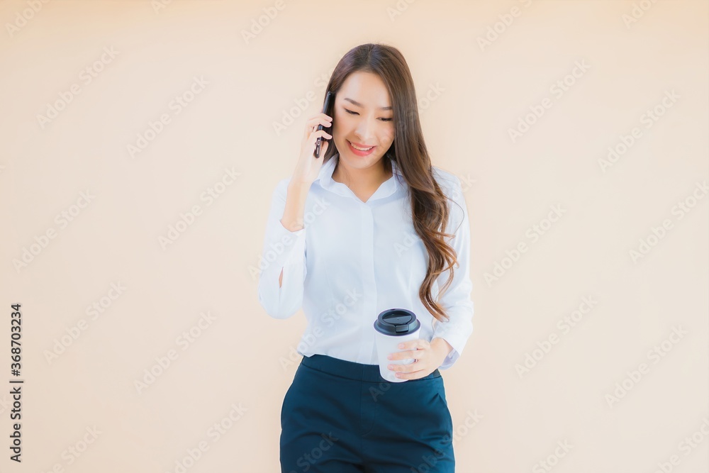 Portrait beautiful young business asian woman with smart mobile phone and coffee Portrait beautiful young business asian woman with smart mobile phone and coffee