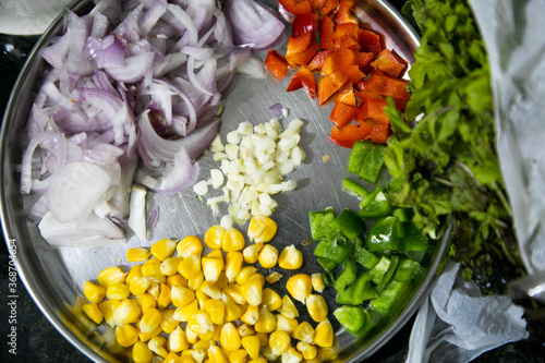 Vegetable Salad saute in Pan with Tomato Brocolli capsicum ready to be prepared for Khow Suey photo