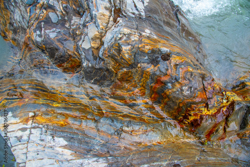 Close up view of rocks on the waters edge in Canada. Abstract, wall art, print. 