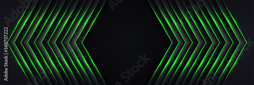 Modern abstract futuristic hexagon carbon fiber and glowing light green luminous lines in black dark room technology background