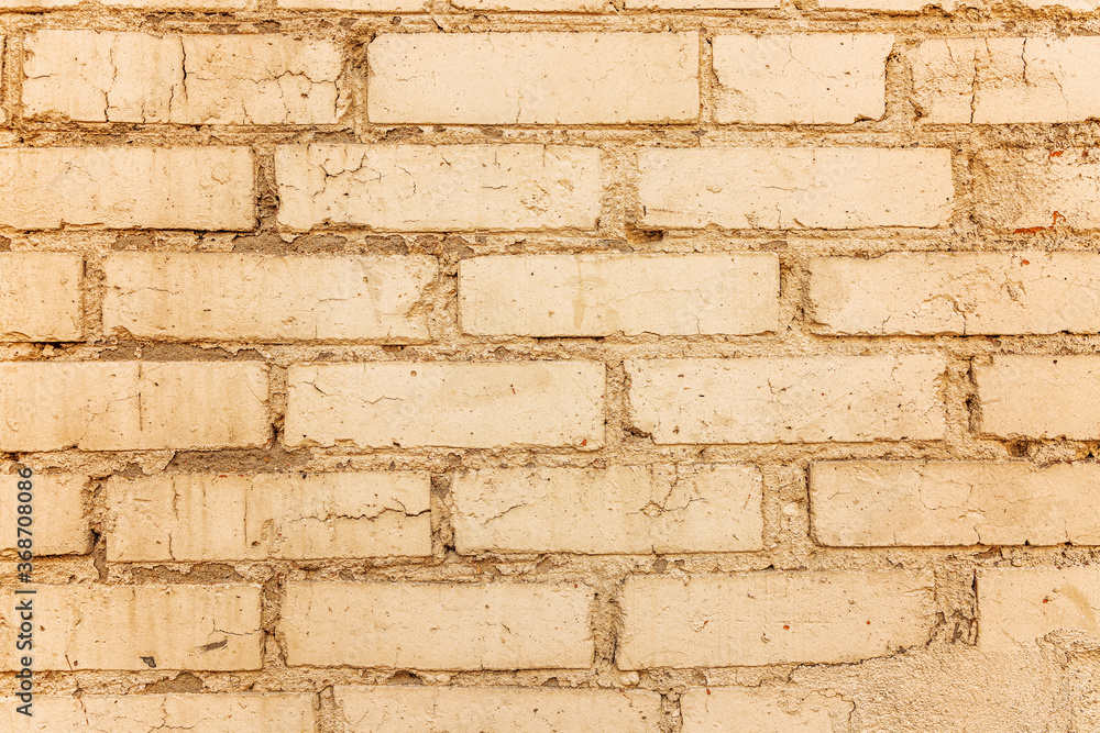 Old beige brick wall. Close-up. Backgrounds and textures. Space for text.