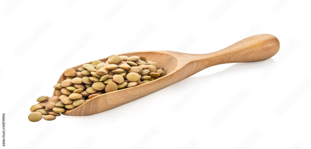 Brown Lentils in wood spoon isolated on white background