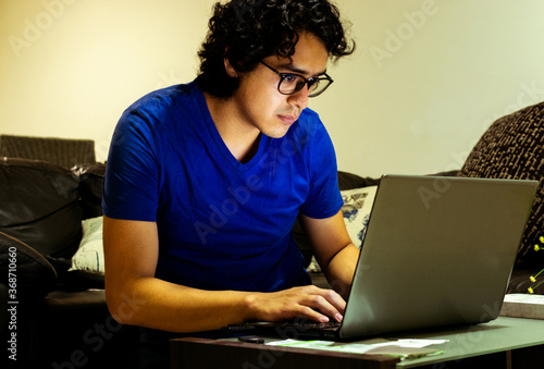 busy guy working hard at home in his computer