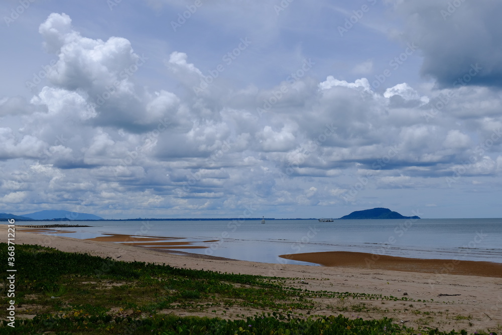 Bright beautiful seascape, sandy beach, clouds reflected in the water, natural minimalistic background and texture Bright beautiful seascape, sandy beach, clouds reflected in the water, natural minimalistic background and texture