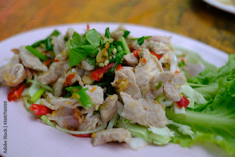Pork with Lemon spicy-sweet sauce with chili and garlic mixed with sour lemon juice. Pork with Lemon spicy-sweet sauce with chili and garlic mixed with sour lemon juice.