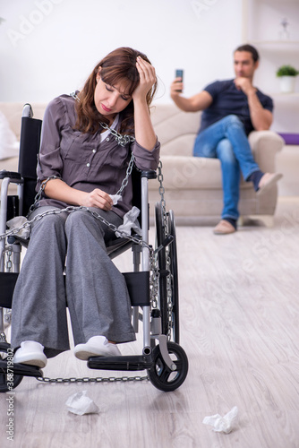 Disabled wife and young husband at home