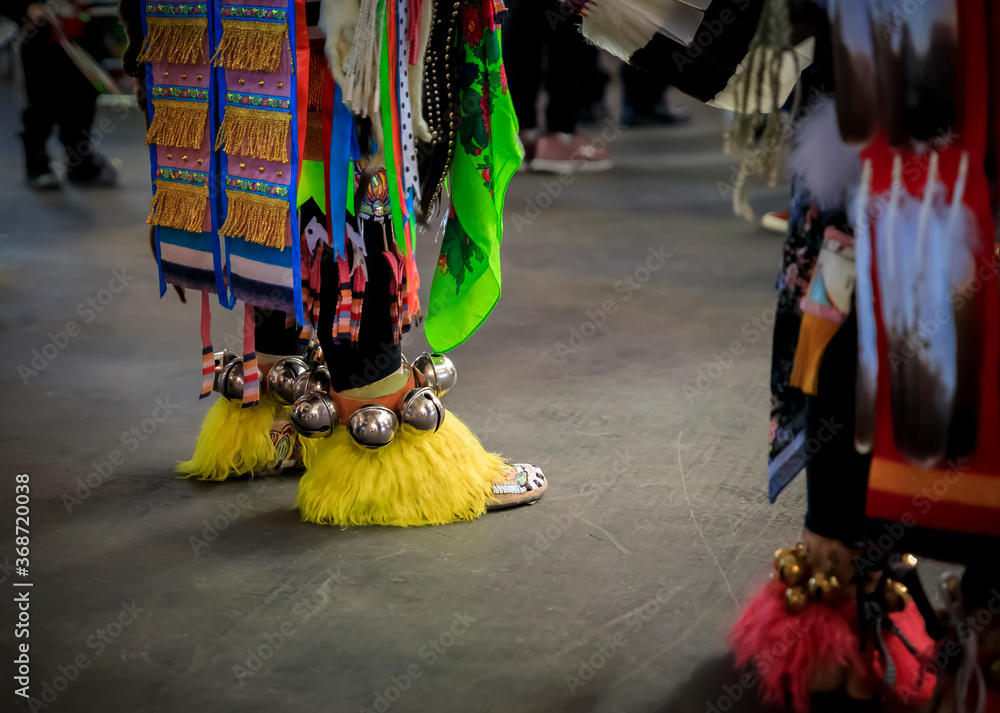 American Indian dancers in handmade beaded leather moccasins decorated with jingle bells at a powwow in San Francisco