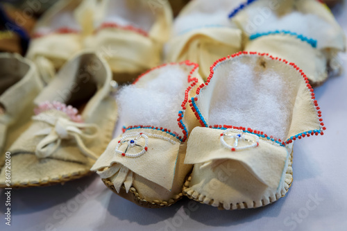 Handmade leather Native American Indian moccasins at a powwow in San Francisco photo