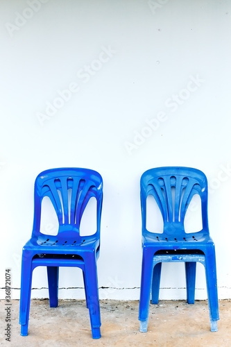 Old and dirty blue plastic chairs