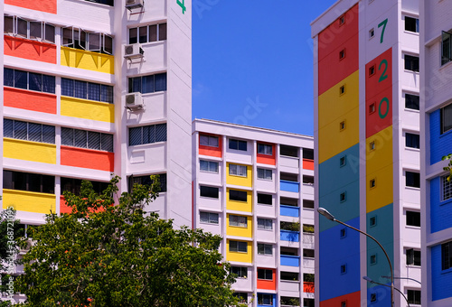 Canvas Print Typical colourful common HDB flats in heartland neighbourhood yishun on a bright sunny day with blue sky