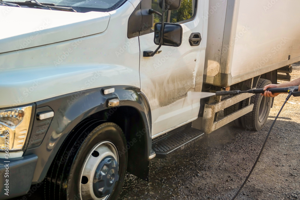 washing the truck with a high-pressure wash washing the truck with a high-pressure wash