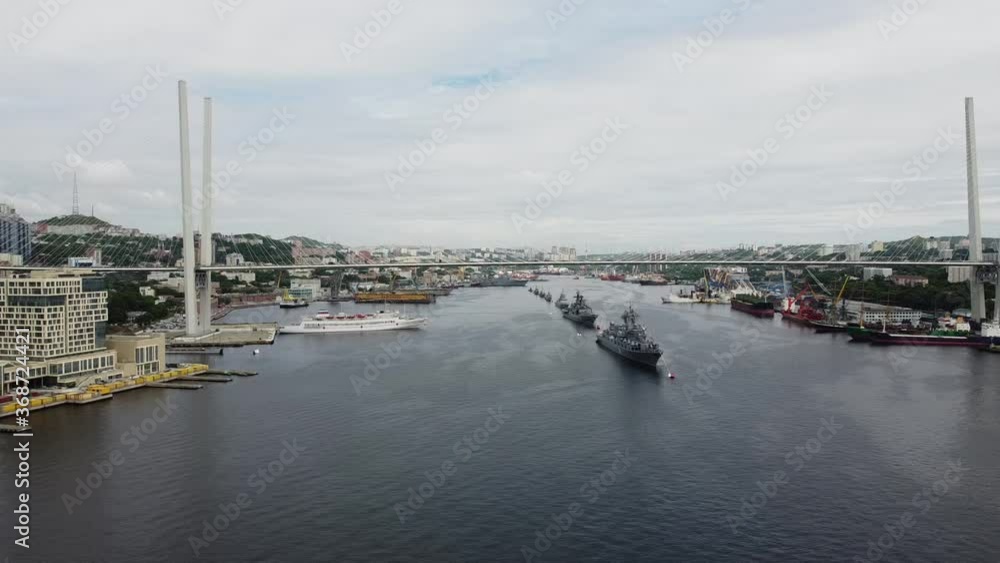 Aerial view over naval ships under the bridge in Vladivostok Aerial view over naval ships under the bridge in Vladivostok