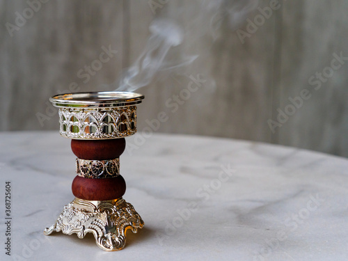Konstfotografi Arabian Bakhoor incense burner emitting white smoke